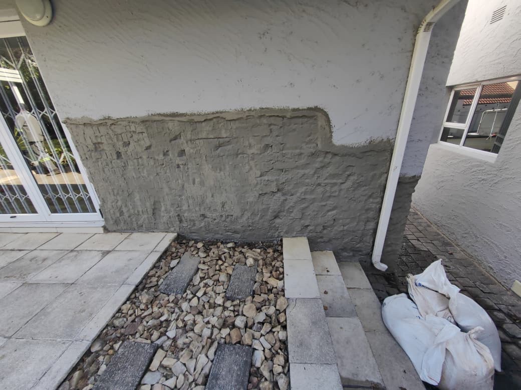 Exterior wall prepared with damp proofing treatment